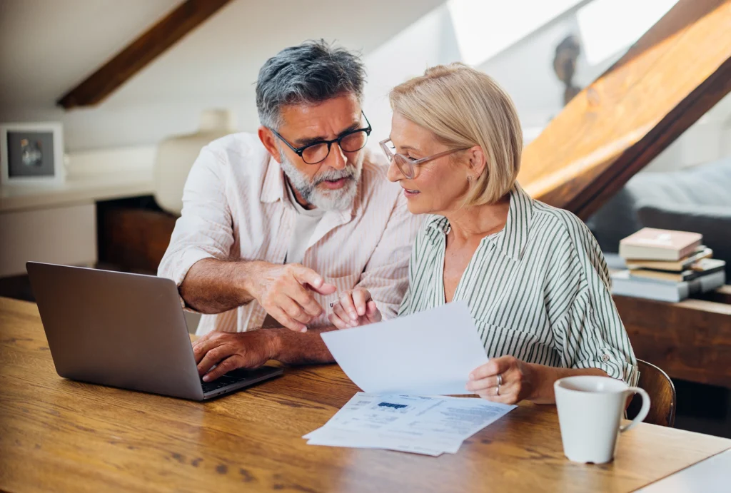 Couple reading about Catch-up contributions 401(k)