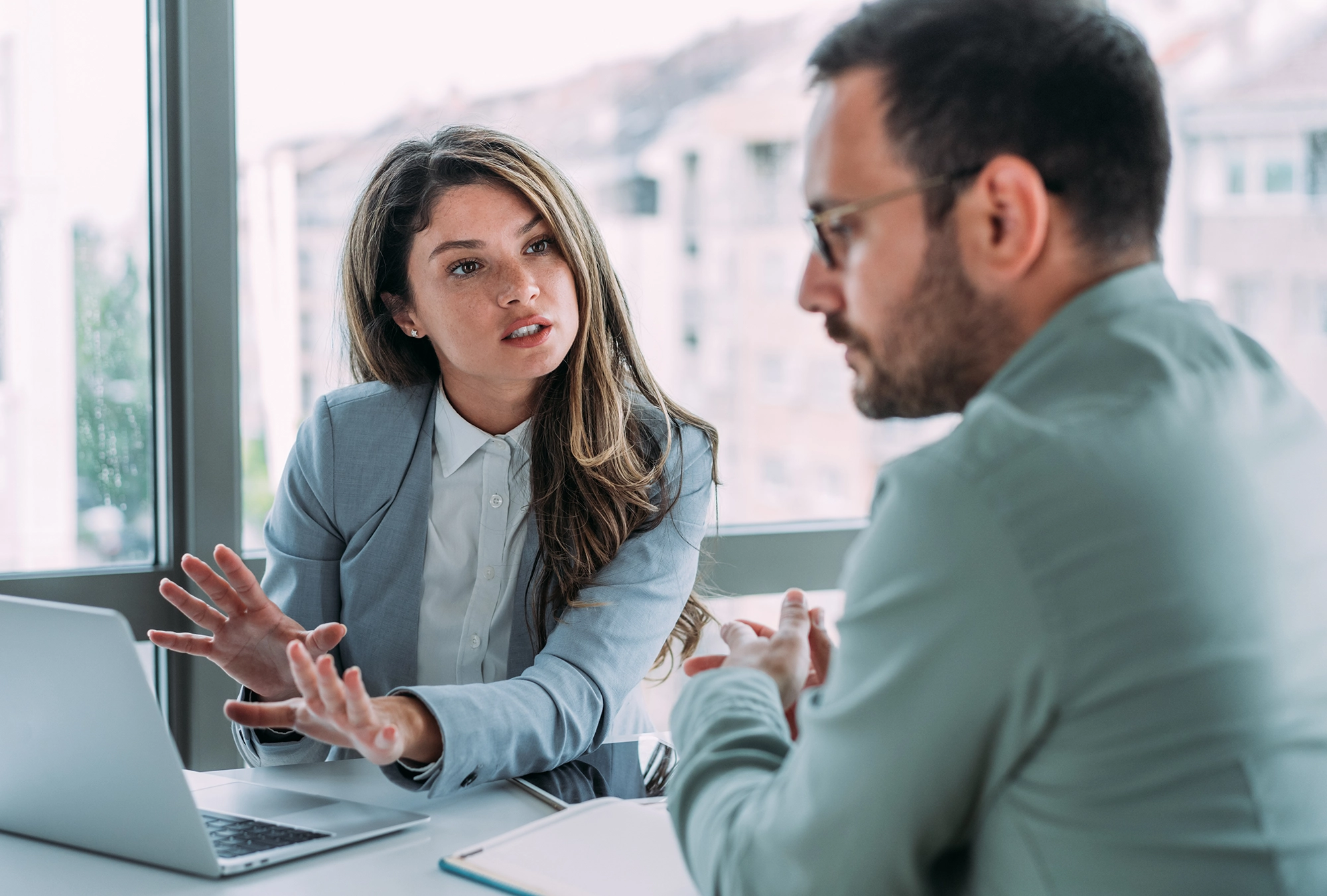 man meeting with wealth advisor in office