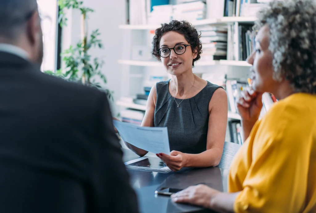 older couple meeting with an investment advisor