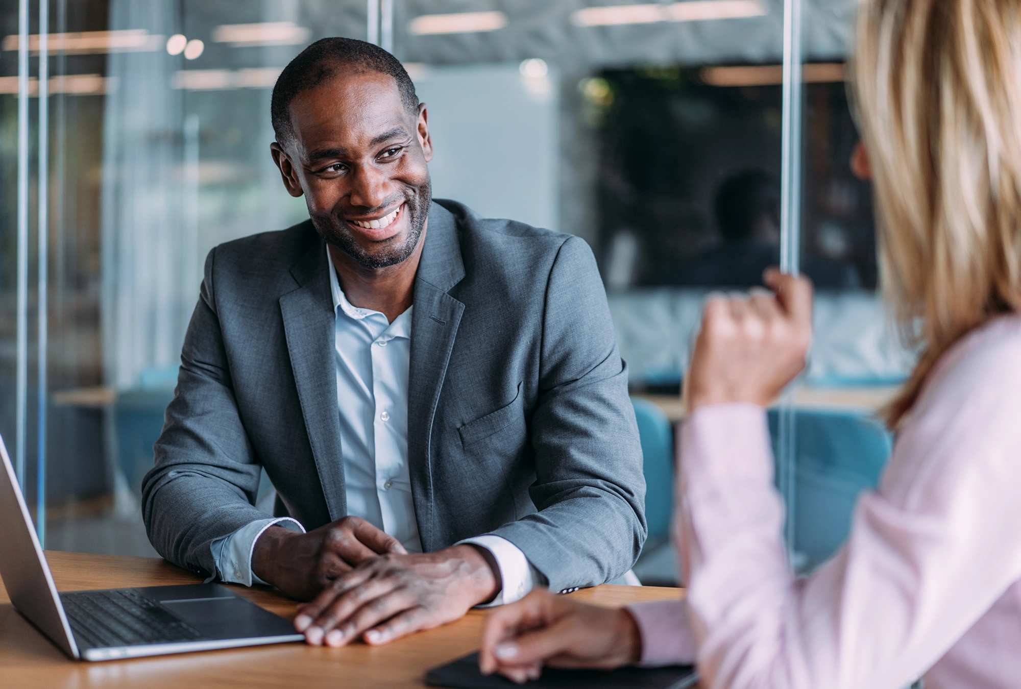Man sitting with a nonprofit investment advisor discussing his options
