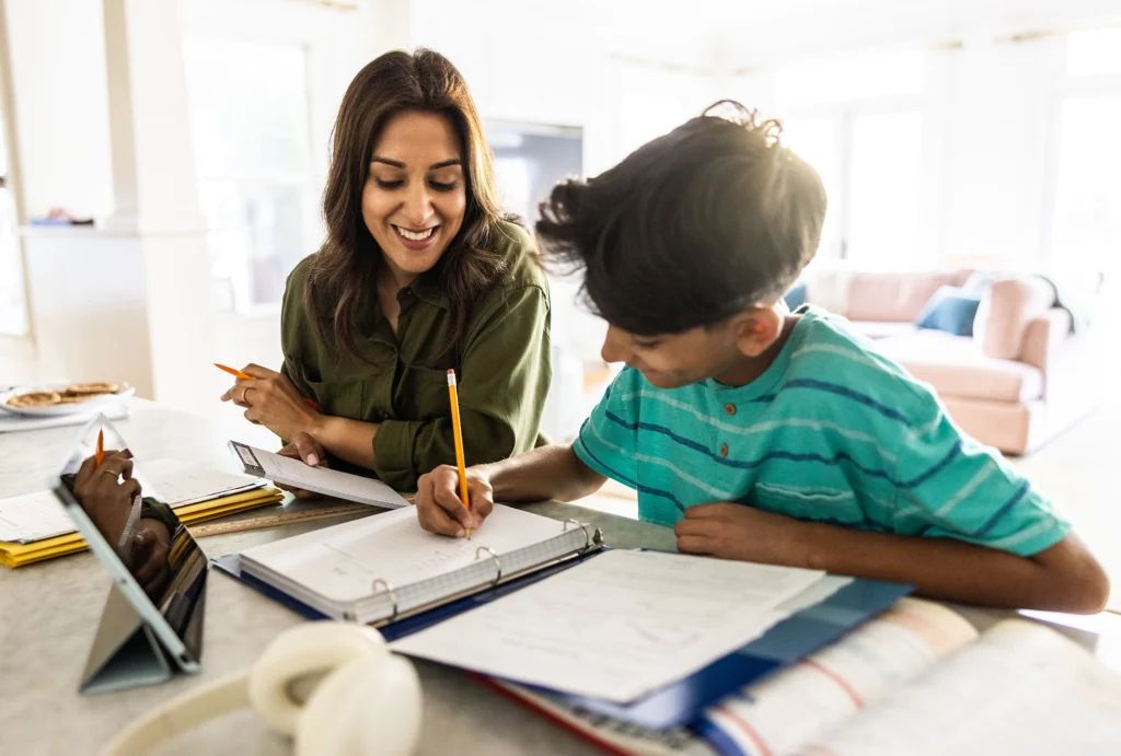 Mom helping her son do his homework