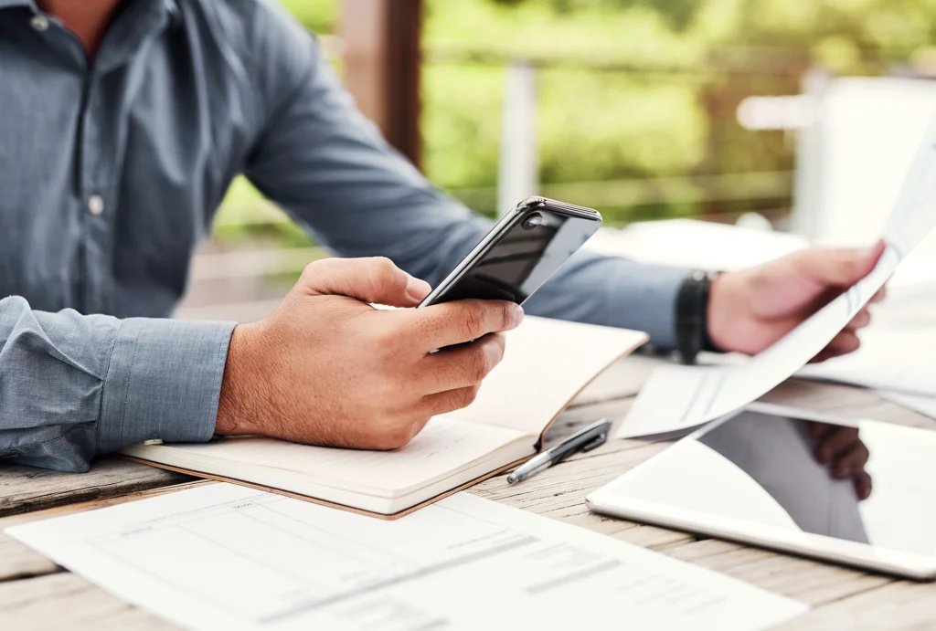 Man sitting at desk looking at tax laws